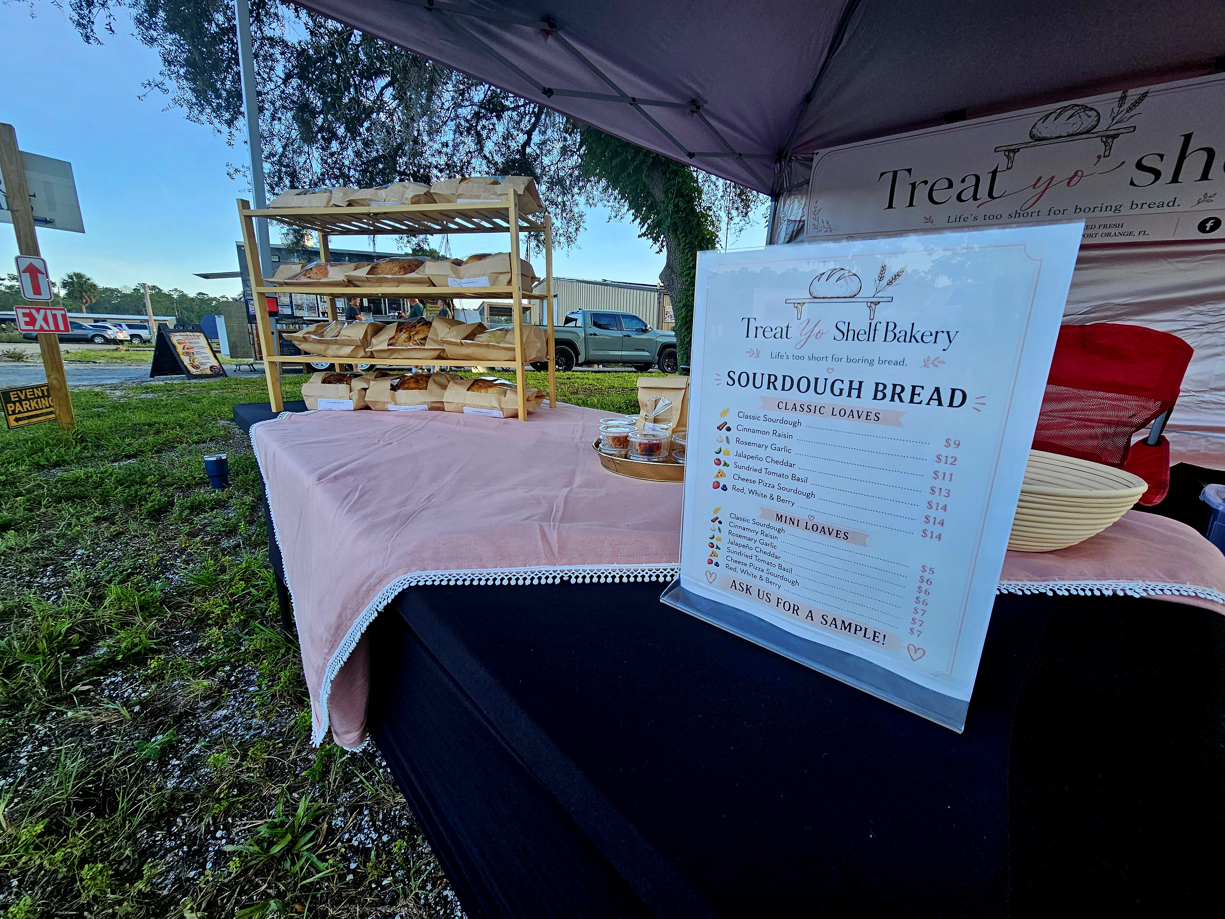 Our bakery table ready for the day with fresh products, menu details, and a welcoming market display.
